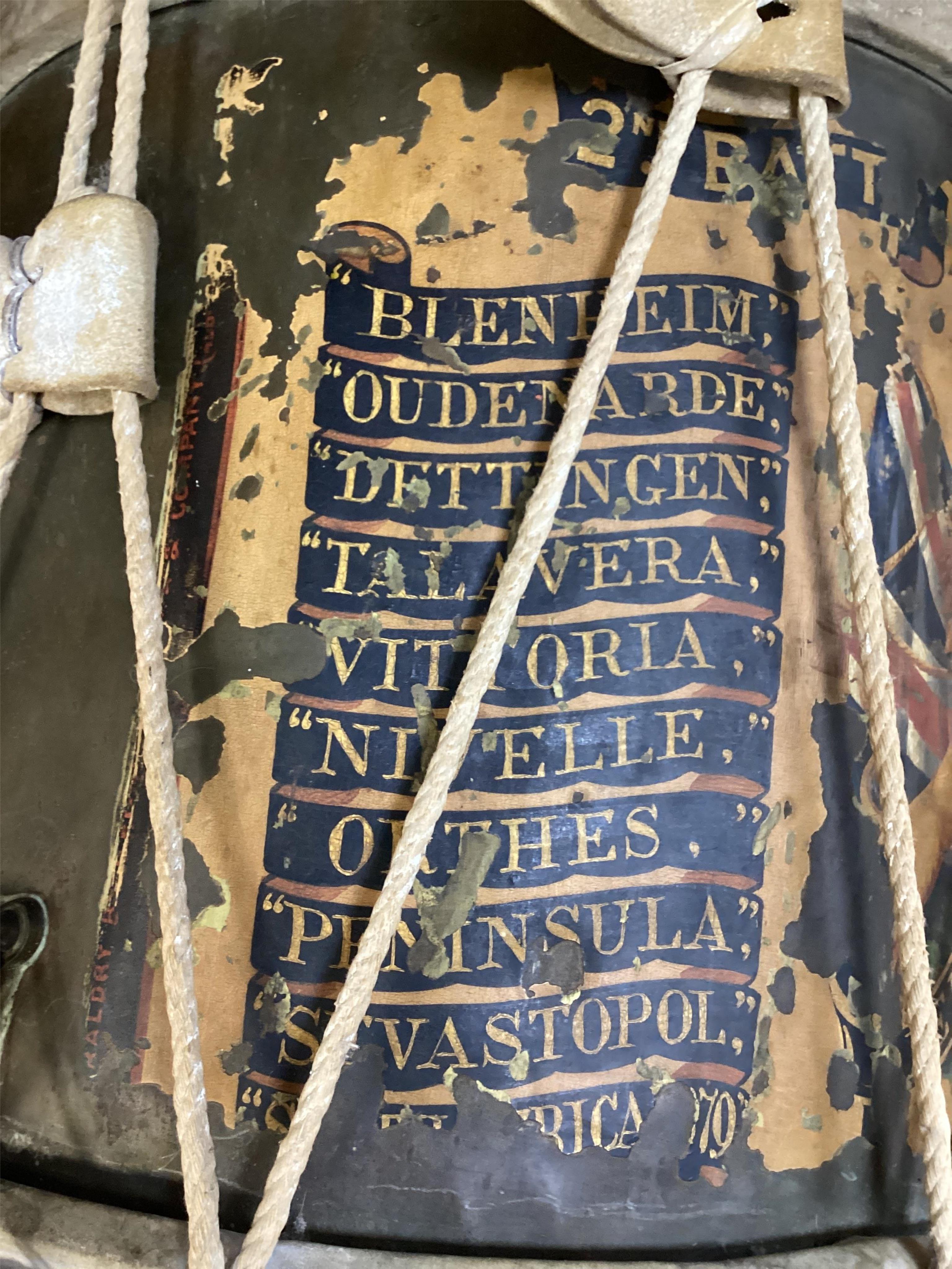 A late 19th/early 20th century Royal East Kent Regiment 'Buffs' regimental drum, 37cm diameter, 37cm high, together with a rope edged, stained pine removable 'table top' adaption